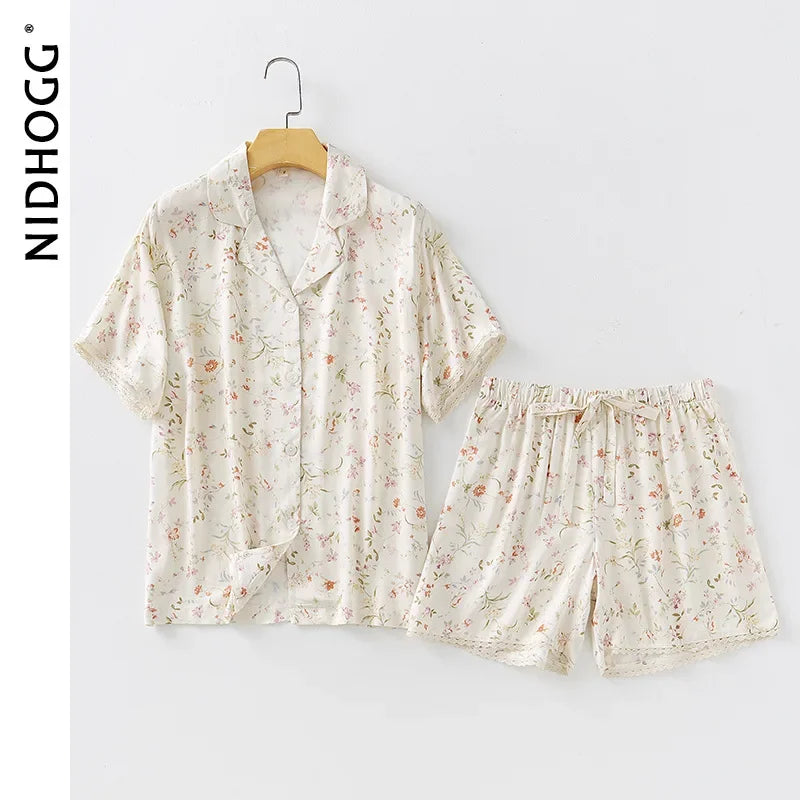 Floral pajama set on a hanger with NIDHOOG branding.